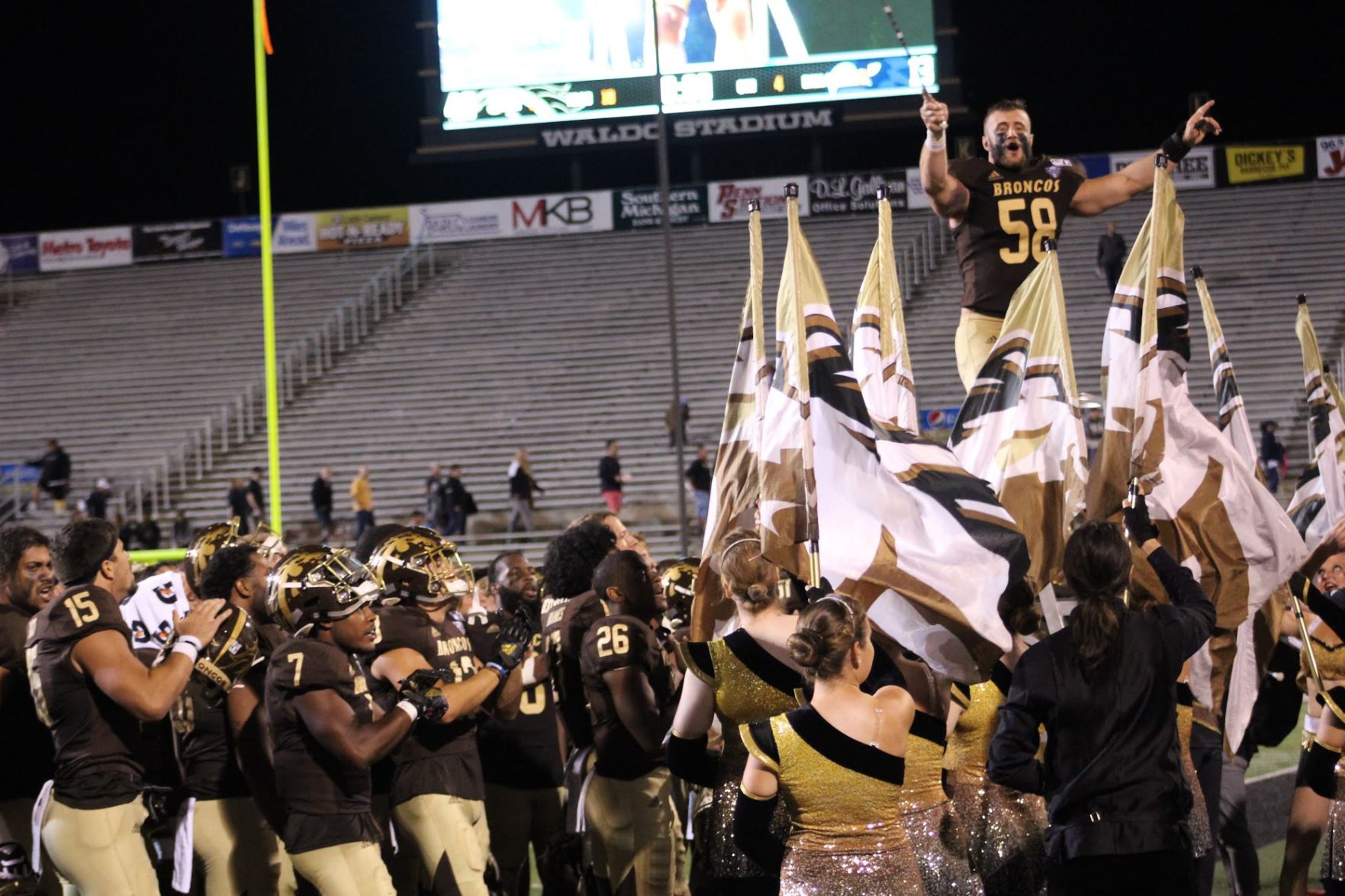 Macomb, MI native Antonio Balabani conducts the band during the playing of the fight song